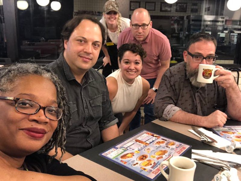 Picture of a groups sitting at a counter at A Waffle House. Picture includes Lisa Welchman and Mike Monteiro