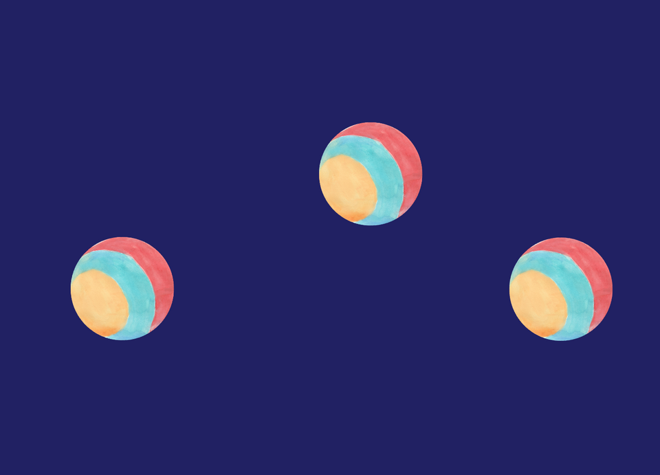 Blue background and three multi-colored balls in mid-air.